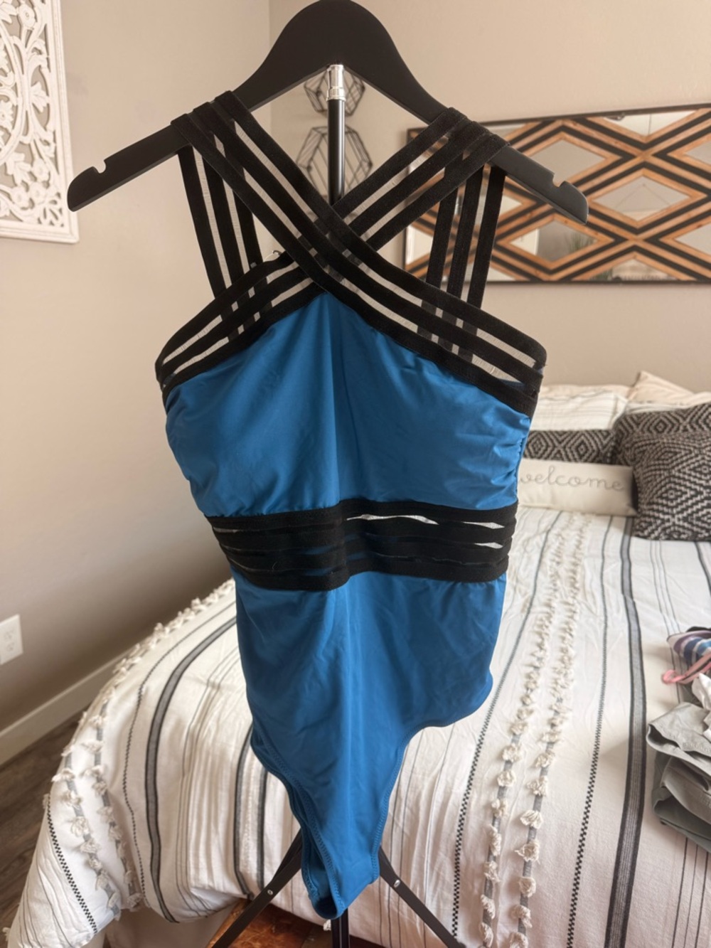 Blue One-Piece Swimsuit with Black Strappy Detail